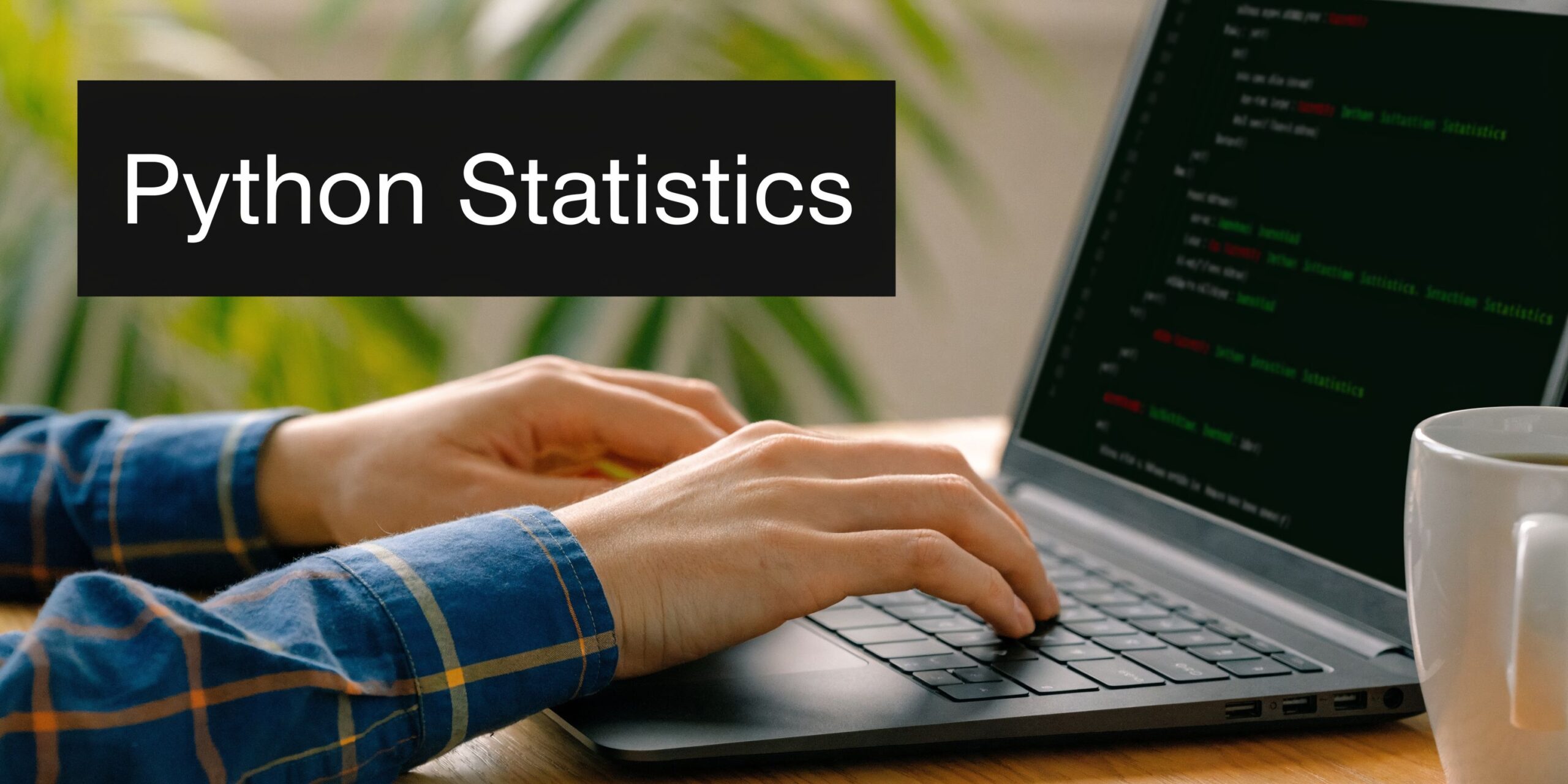 A close up view of a person coding Python statistics on a laptop computer at a desk.