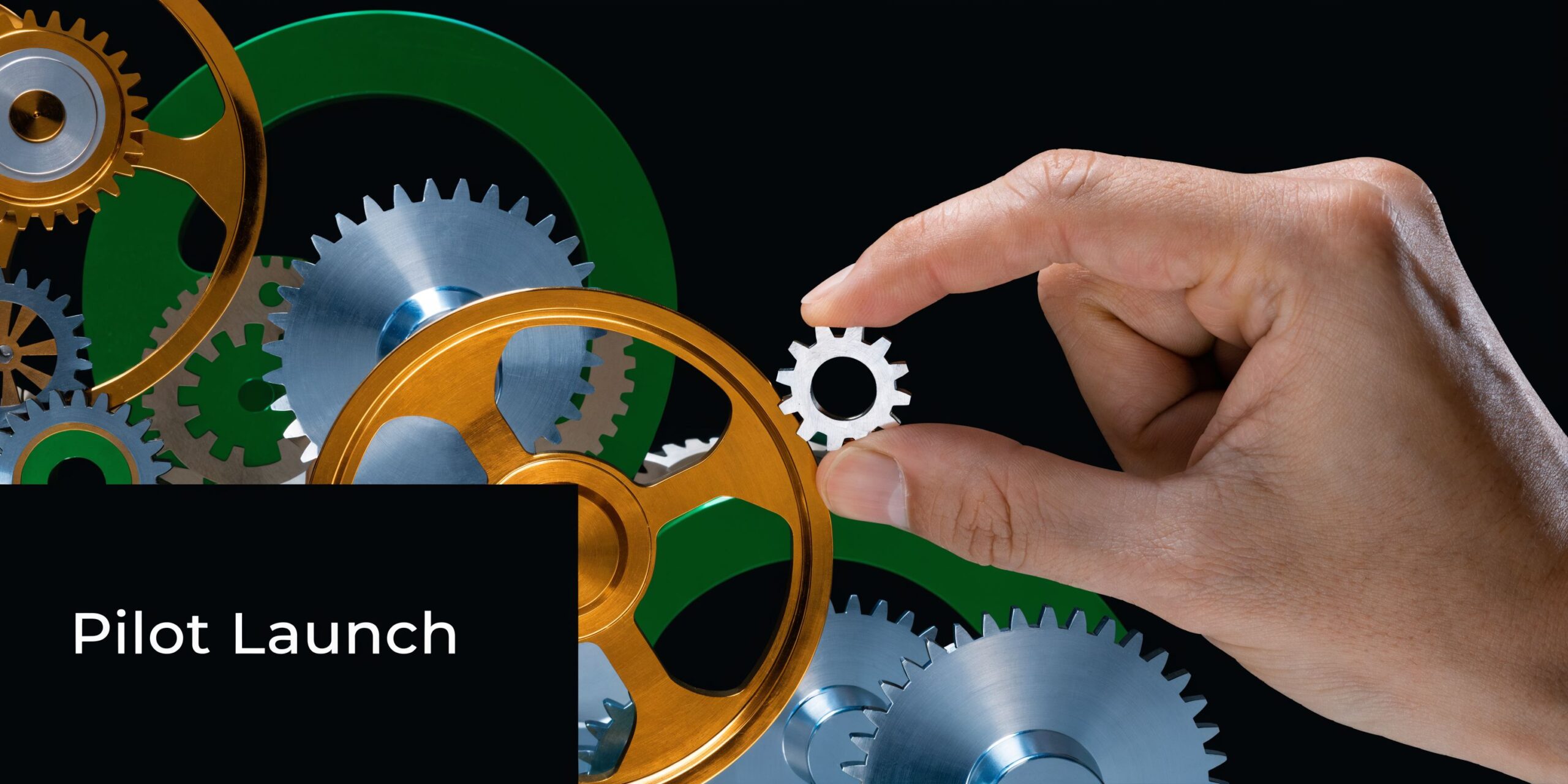 A hand placing a small gear into a complex mechanical system of interlocking gears and cogs.